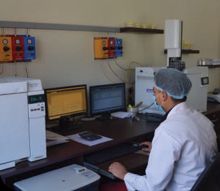 Quality analyst running a gas chromatograph in the N S Mint laboratory